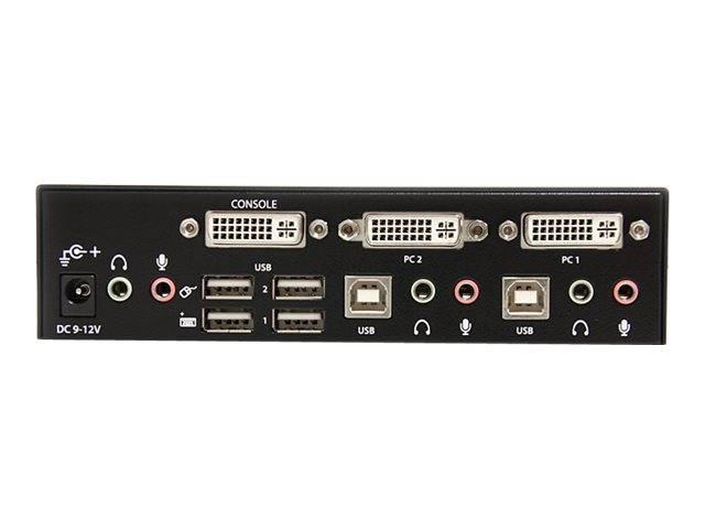 Vorderansicht eines schwarzen KVM-Schalter-Bedienfelds mit drei DVI-Anschlüssen mit den Bezeichnungen Konsole, PC 2 und PC 1, sowie USB-Anschlüssen und Audio-/Mikrofon-Buchsen an der Vorderseite.