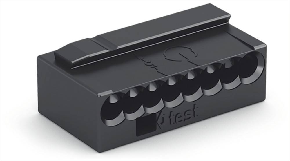 Eine schwarze, rechteckige elektronische Komponente mit fünf kreisförmigen Vertiefungen, die mit 