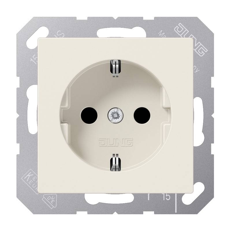 Beige elektrische Wandsteckdose mit zwei runden Löchern und einer zentralen Schraube, dargestellt in einem Metallrahmen montiert.
