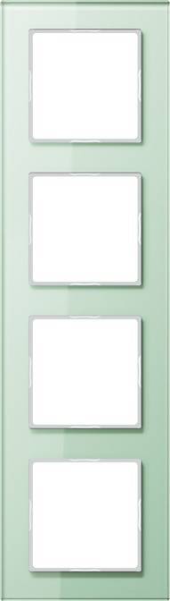 Ein grünes Lichtschaltertableau mit zwei leeren Aussparungen für Schalter, umrahmt von weißen Einfassungen.