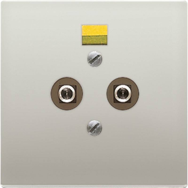 Eine beige Wandplatte mit zwei runden Anschlüssen und einem kleinen gelben Rechteck darüber.