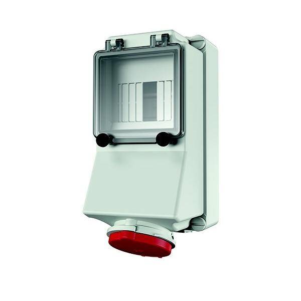 Ein elektrisches Gehäuse mit transparentem Deckel, das Mess- oder Steuerungsausrüstung beherbergt. Eine rote kreisförmige Komponente befindet sich am unteren Rand.