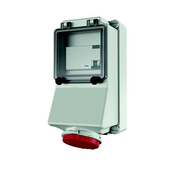 Ein elektrisches Gerät, das an einer Wand montiert ist, mit einer schützenden transparenten Abdeckung und einem roten Knopf unten, möglicherweise für den Notfallgebrauch.