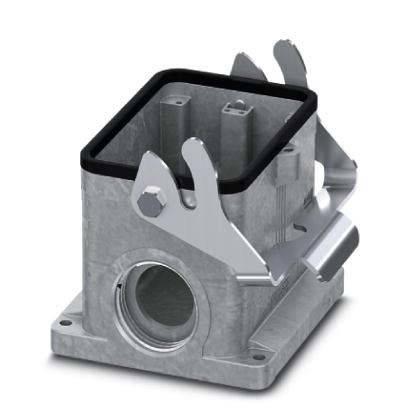 Ein metallisches rechteckiges Gerät mit Montagebügeln und einer kreisförmigen Öffnung an der Basis, das für elektrische Anschlüsse verwendet wird.