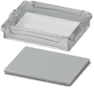 Eine klare rechteckige Plastikseifenschale mit einem erhöhten Rand, auf der ein separater rechteckiger grauer Seifenriegel daneben liegt.