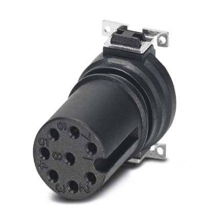 Ein schwarzer elektrischer Steckverbinder mit mehreren kreisförmigen Stiften in einer runden Anordnung, von einer seitlichen Winkelansicht vor einem einfarbigen Hintergrund gezeigt.