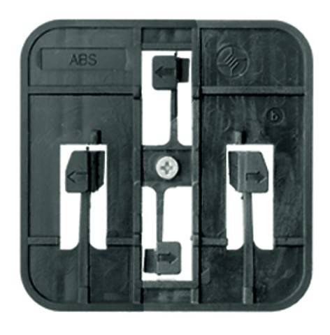 Eine schwarze Kunststoffkomponente mit der Markierung 'ABS' und Pfeilmarkierungen, die Schlitze und eine zentrale Schraube für Montage- oder Zusammenbauarbeiten aufweist.