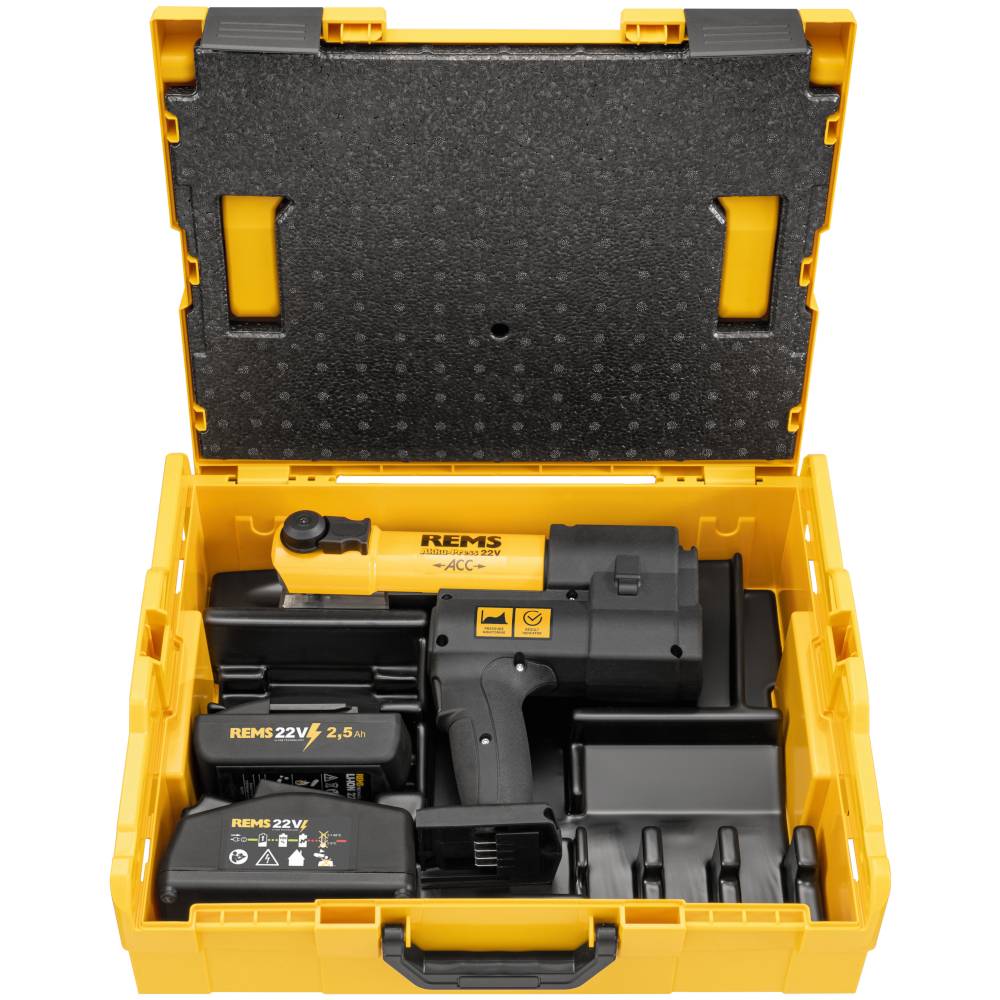 Öffnen Sie den gelben Werkzeugkoffer mit einem REMS 22V Akku-Elektrowerkzeug, zwei Batterien, Ladegerät und Zubehör, ordentlich im Inneren angeordnet.