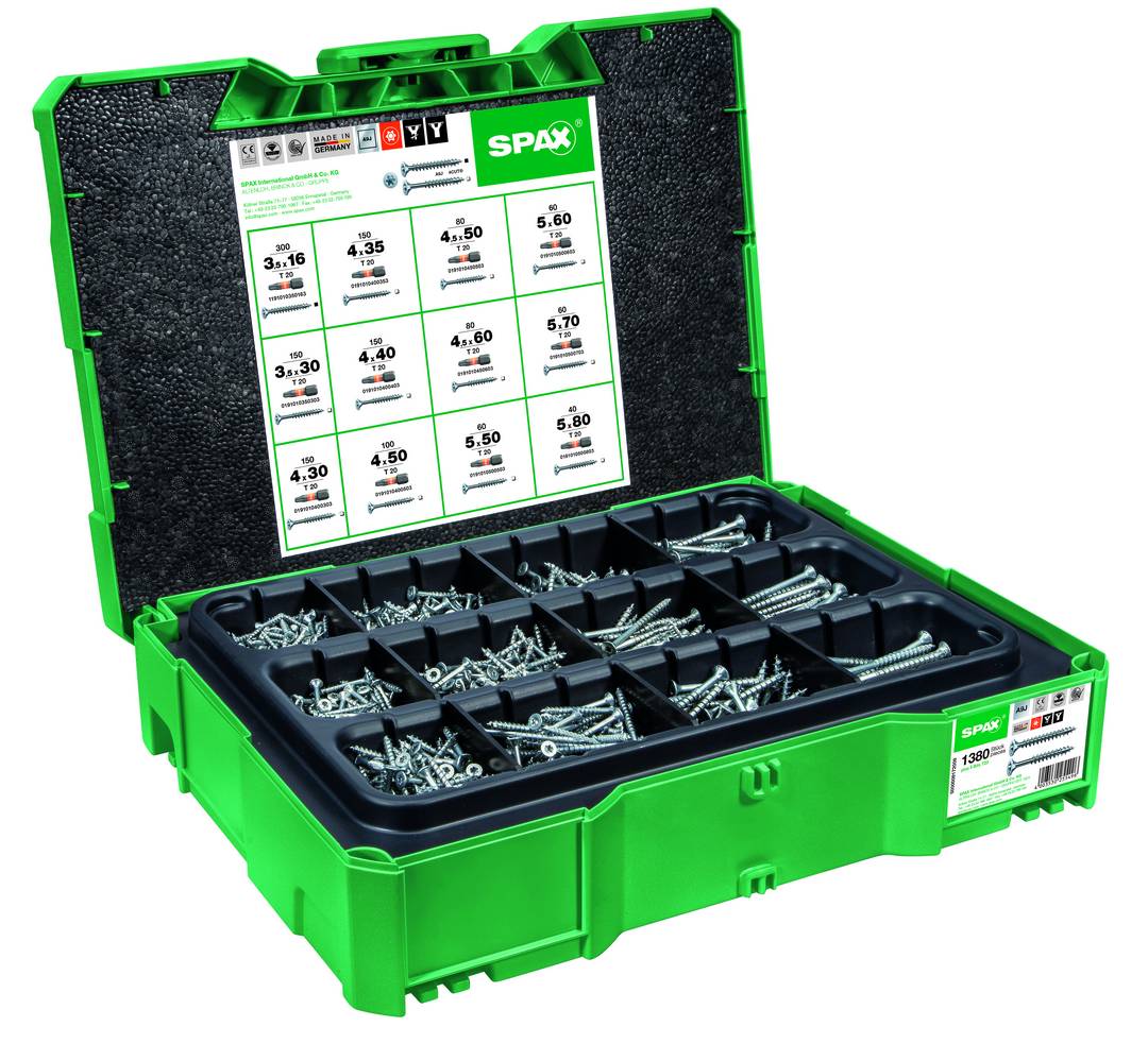 Offene grüne SPAX-Organisatorbox mit beschrifteten Fächern verschiedener Schrauben und Befestigungselemente.