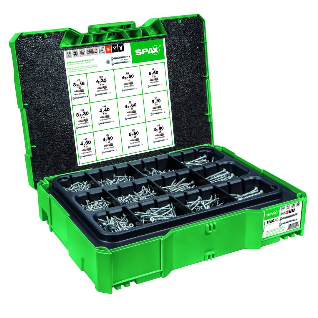 Offene grüne SPAX-Organisatorbox mit sortierten Schrauben in Fachabteilungen, mit Größenleitfaden auf der Innenseite des Deckels.