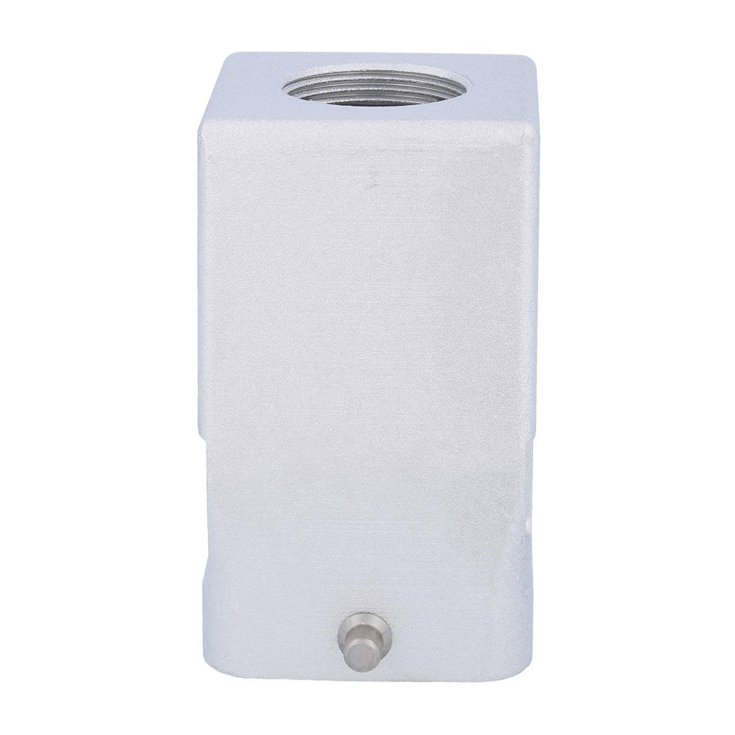 Ein metallischer, rechteckiger Block mit einem Gewindeloch oben und einer kleinen Vorsprung an der Unterseite, wahrscheinlich eine mechanische oder industrielle Komponente.