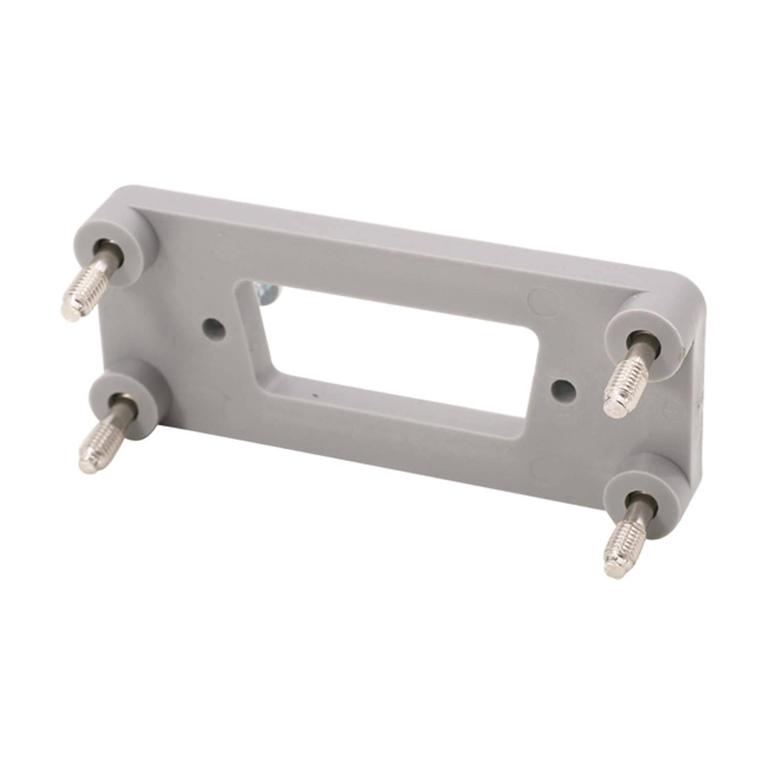 Graues rechteckiges Befestigungselement mit vier hervorstehenden Gewindeschrauben, konzipiert zum Sichern von Objekten oder Befestigungselementen an Ort und Stelle.