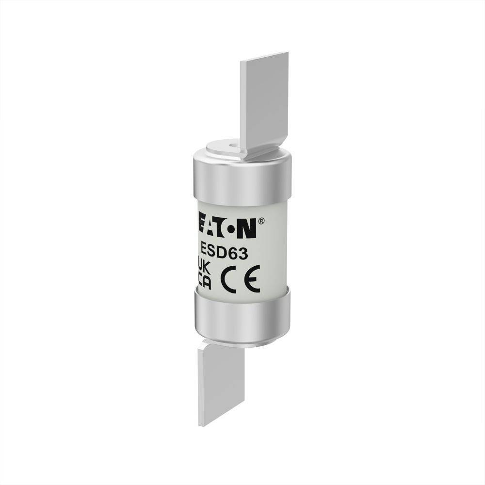 Eine zylindrische EATON Elektrosicherung mit der Bezeichnung 'ESD63' und Metallverbindern an beiden Enden, gekennzeichnet mit UKCA- und CE-Logos.
