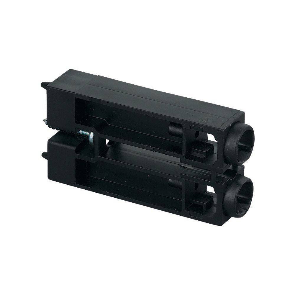 Eine schwarze Kunststoff-Elektronikkomponente mit zwei zylindrischen Öffnungen, die in technischen Baugruppen oder elektronischen Geräten verwendet wird.