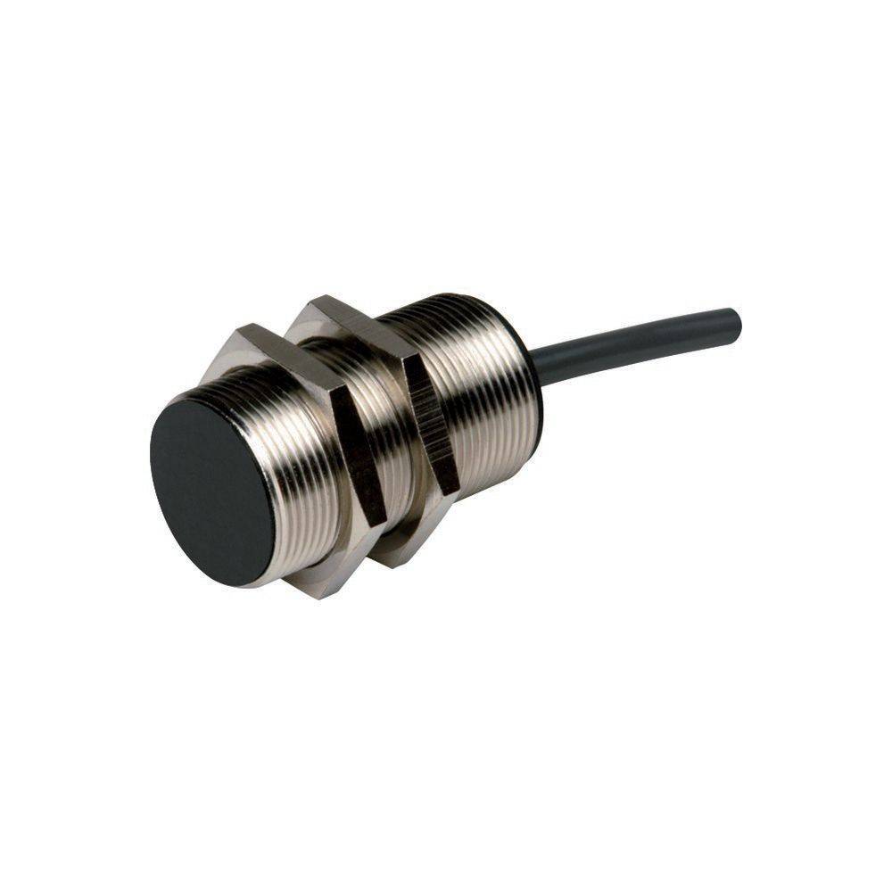 Ein metallischer zylindrischer Sensor mit einer schwarzen Vorderseite und einem Kabel, das aus der Rückseite herausragt, der in der industriellen Automatisierung verwendet wird.