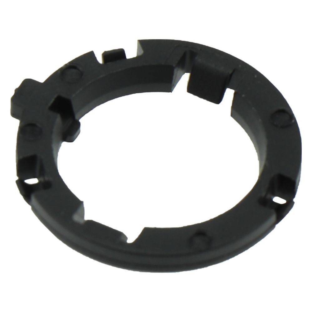 Ein schwarzer, kreisförmiger Kunststoffring mit Kerben und Vorsprüngen, möglicherweise eine mechanische Komponente oder ein Teil.