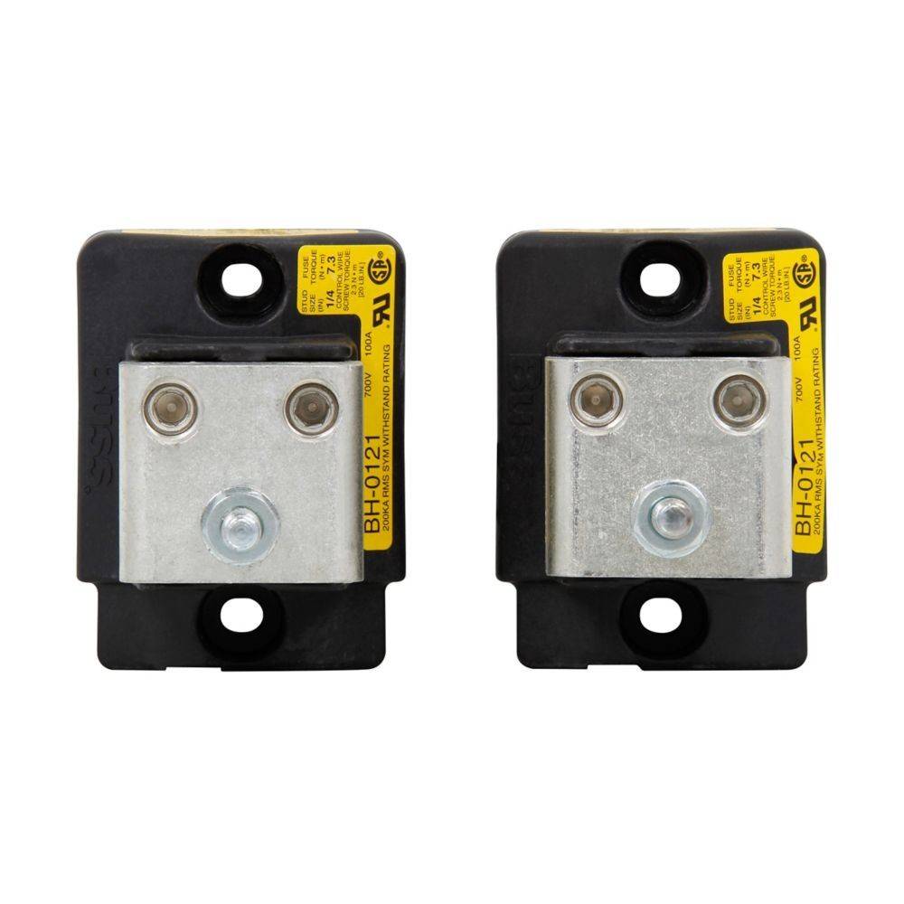 Zwei elektrische Sicherungsautomaten mit gelben Etiketten, schwarzem Gehäuse und Metallkomponenten, nebeneinander an einer weißen Wand montiert.