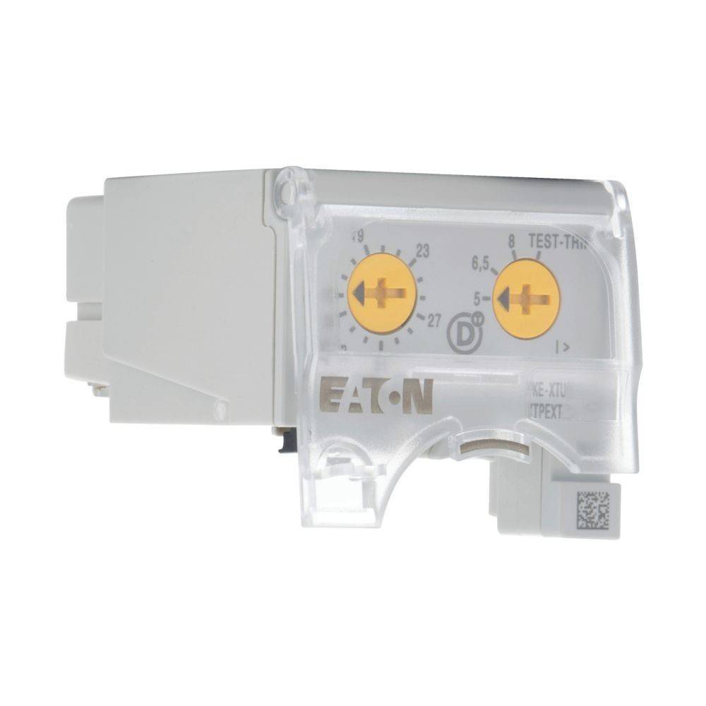 Eaton' Marken-Schütz-Hilfskontakt, Seitenansicht mit Testauslösetaste und transparentem Gehäuse, die interne mechanische Details offenlegt.