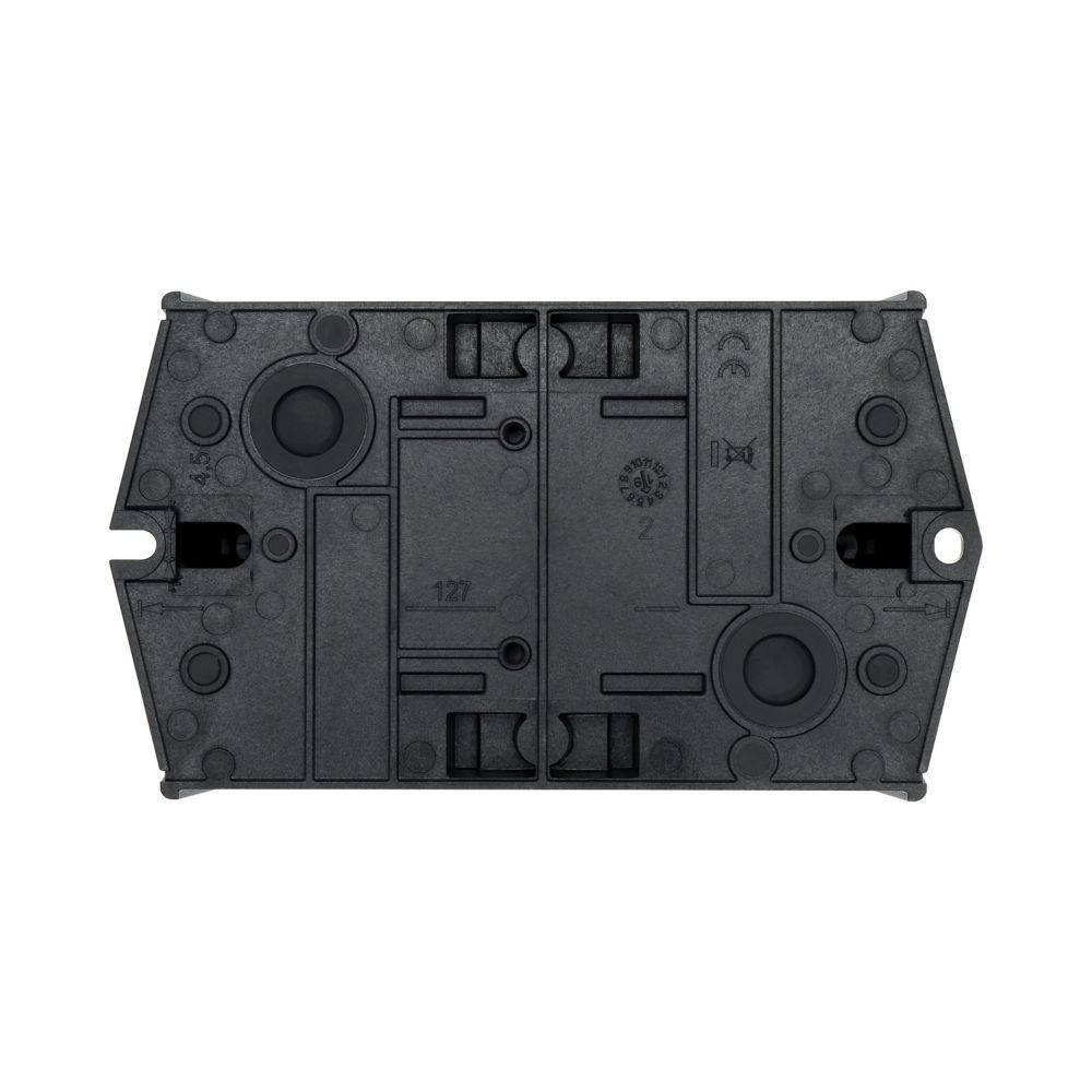 Eine rechteckige schwarze elektronische Komponente mit verschiedenen runden und rechteckigen Vertiefungen, wahrscheinlich Teil eines Schaltkreises oder Gerätegehäuses.