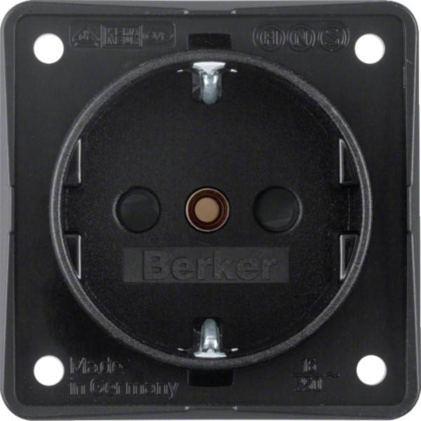 Schwarzer Becker Elektro-Wandsteckdose mit rundlicher Vertiefung und vier Befestigungslöchern auf einer quadratischen Platte.