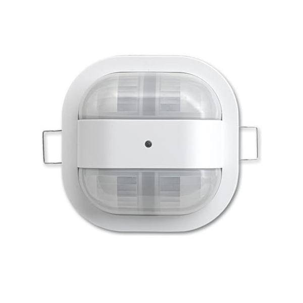 Ein weißer, rechteckiger Bewegungsmelder mit einer zentralen Linse, für die Deckeninstallation konzipiert, zur Bewegungserkennung in einem Raum.