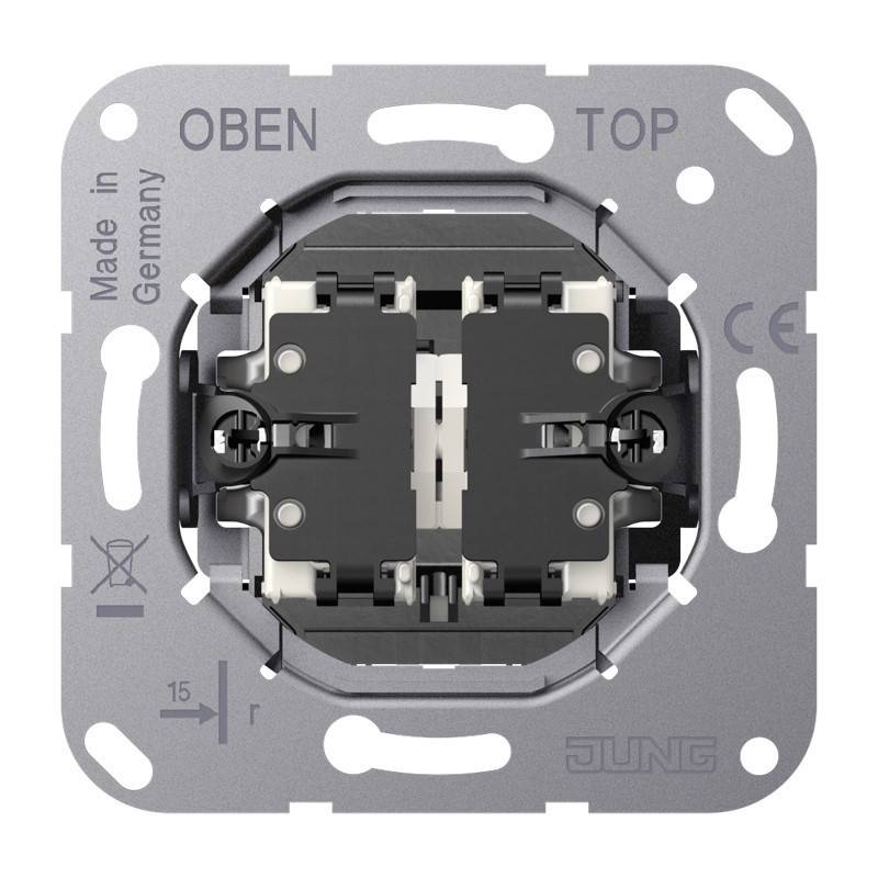 Vorderansicht eines JUNG-Elektroschalters an einer Metallmontageplatte, gekennzeichnet mit „OBEN/TOP
