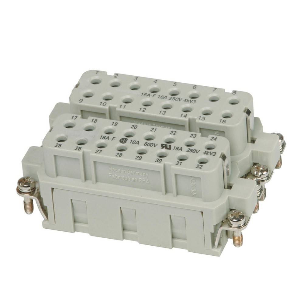 Ein grauer Mehrfach-Steckverbinder mit beschrifteten Anschlusspunkten zur Kabelverwaltung.