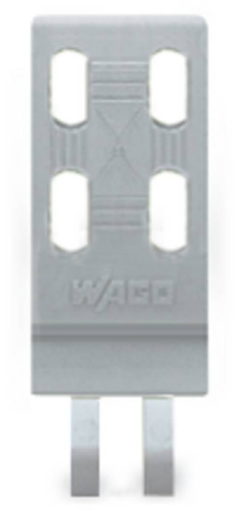 Eine Nahaufnahme einer Komponente mit der Markenaufschrift ‚WAGO', die zwei rechteckige Schlitze und ein geometrisches Muster darüber aufweist.