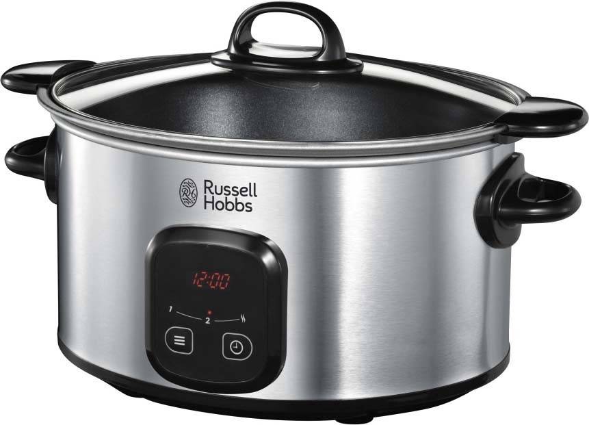 Edelstahl-Slow Cooker mit digitaler Anzeige, die '12:00' zeigt. Schwarze Griffe und mit der Markenbezeichnung 'Russell Hobbs' versehen.