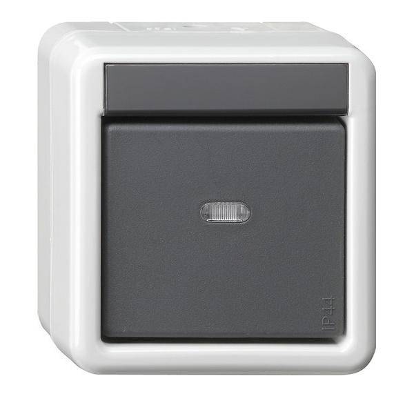 Ein grauer Lichtschalter mit Schutzabdeckung, gekennzeichnet mit IP44, geeignet für den Außeneinsatz.