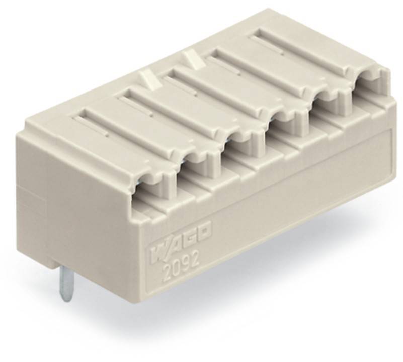 Ein beige farbener Kunststoff-Verbindungsblock mit Schlitzen und Metallstiften für elektrische Verkabelung, seitlich mit der Beschriftung 