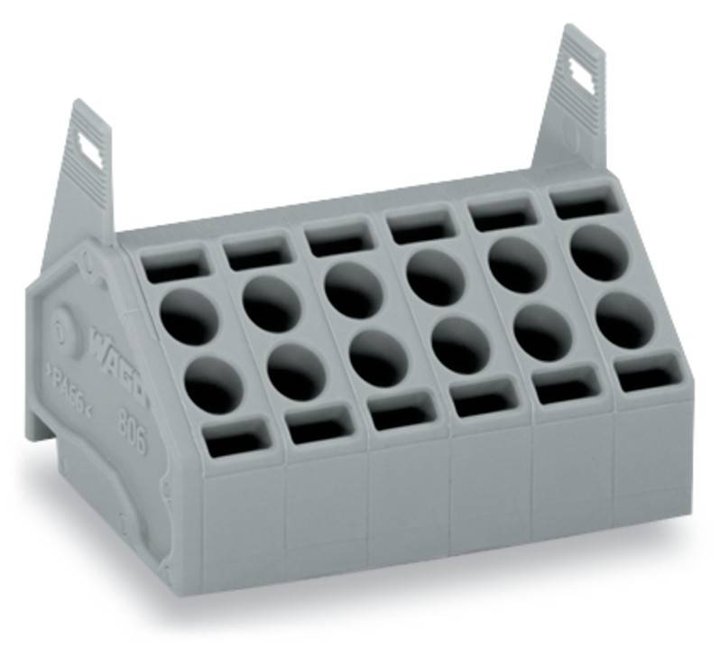 Ein grauer Plastik-Terminalblock mit mehreren Öffnungen für elektrische Leitungsanschlüsse.