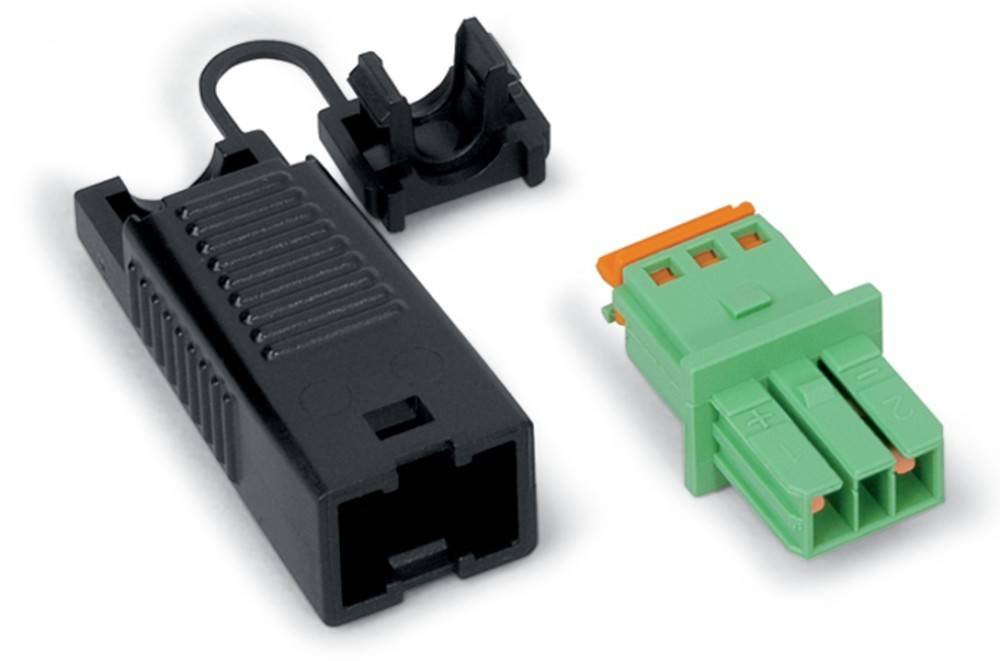Ein schwarzer rechteckiger elektrischer Anschluss mit einem Verschluss und ein grüner Stecker mit einem orangen Oberteil, der die Kompatibilität zum Verbinden von Komponenten anzeigt.