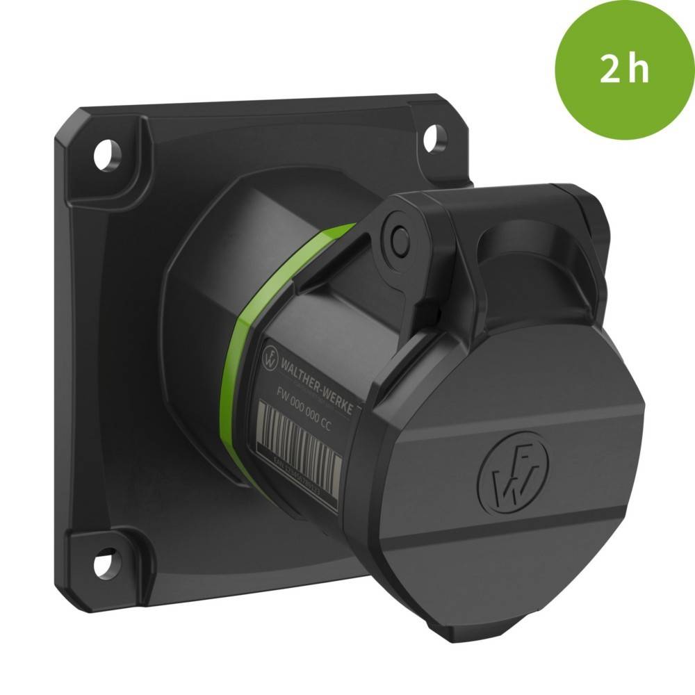 Eine schwarze Steckdose mit einer grünen Beschriftung in der Ecke, die '2h' anzeigt. Die Steckdose ist auf einer quadratischen schwarzen Platte montiert.