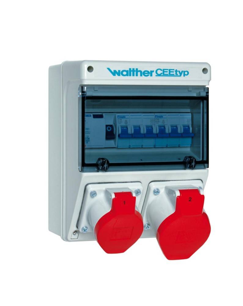 Elektrische Verteilerdose mit 'Walther CEE-Typ' Aufschrift, transparenter Abdeckung und zwei roten Stromanschlüssen darunter.