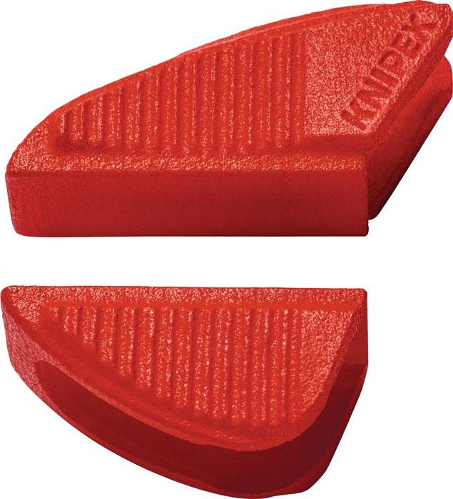 Ein roter Radiergummi mit einer strukturierten Oberfläche und abgeschrägten Kanten, entwickelt für präzises Radieren.