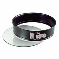 Eine runde, antihaftbeschichtete Springform mit silbernem Verschluss, getrennt von ihrer Glaskaschierbasis, konstruiert für die einfache Entfernung von Backwaren.