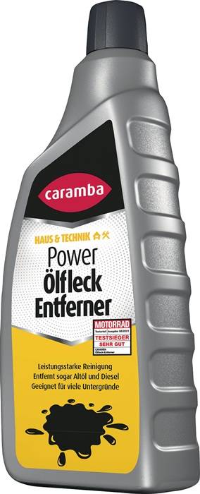 Eine Flasche 'Caramba Power Ölfleck Entferner' mit einem silber-schwarzen Design. Etiketten weisen auf die Eignung zum Entfernen von Ölflecken und eine Qualitätsauszeichnung hin.