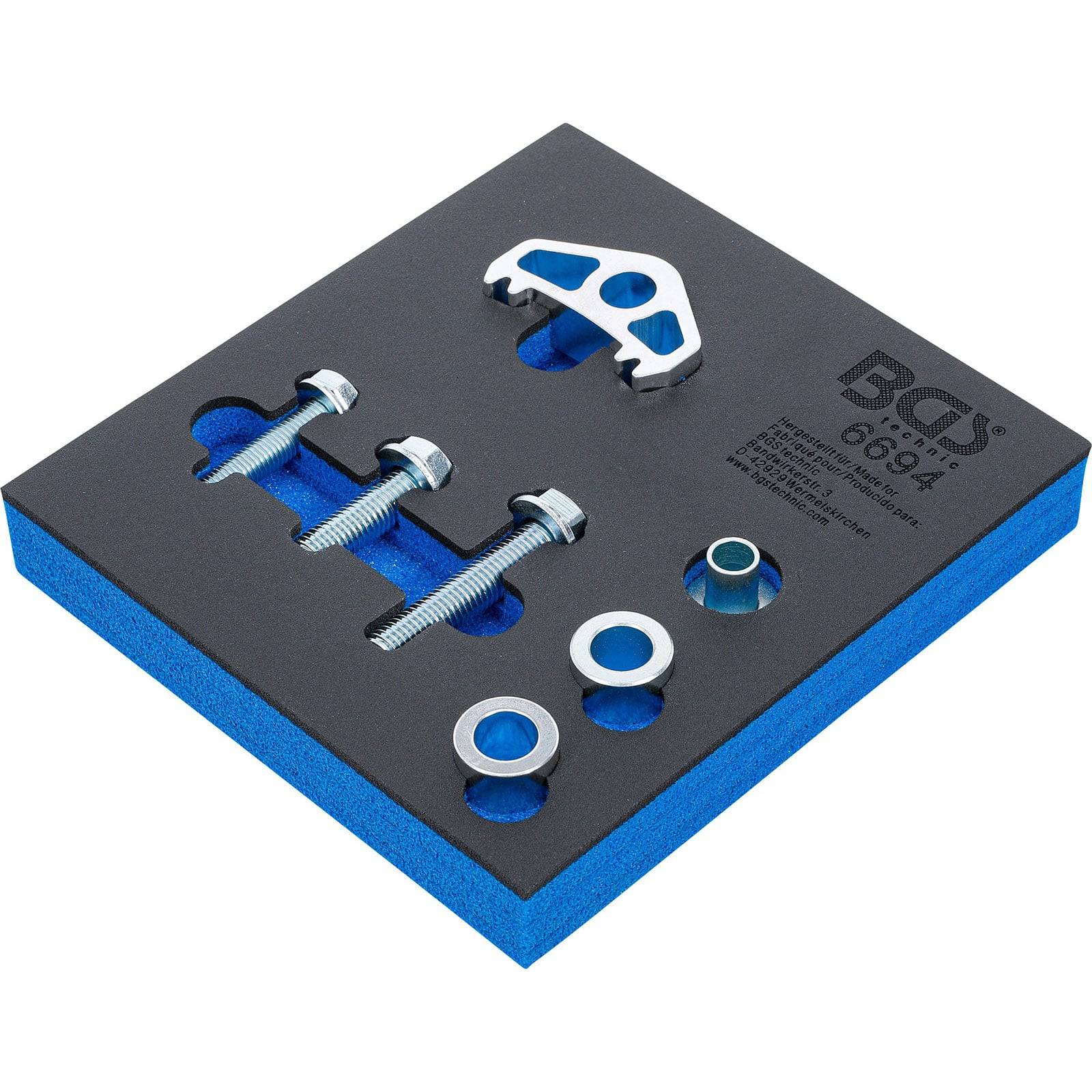 Ein Werkzeugsatz auf einem blau-schwarzen Schaumstoff-Tablett umfasst einen Bremsscheibenkolben-Spreizer, zwei Schrauben und drei Unterlegscheiben.