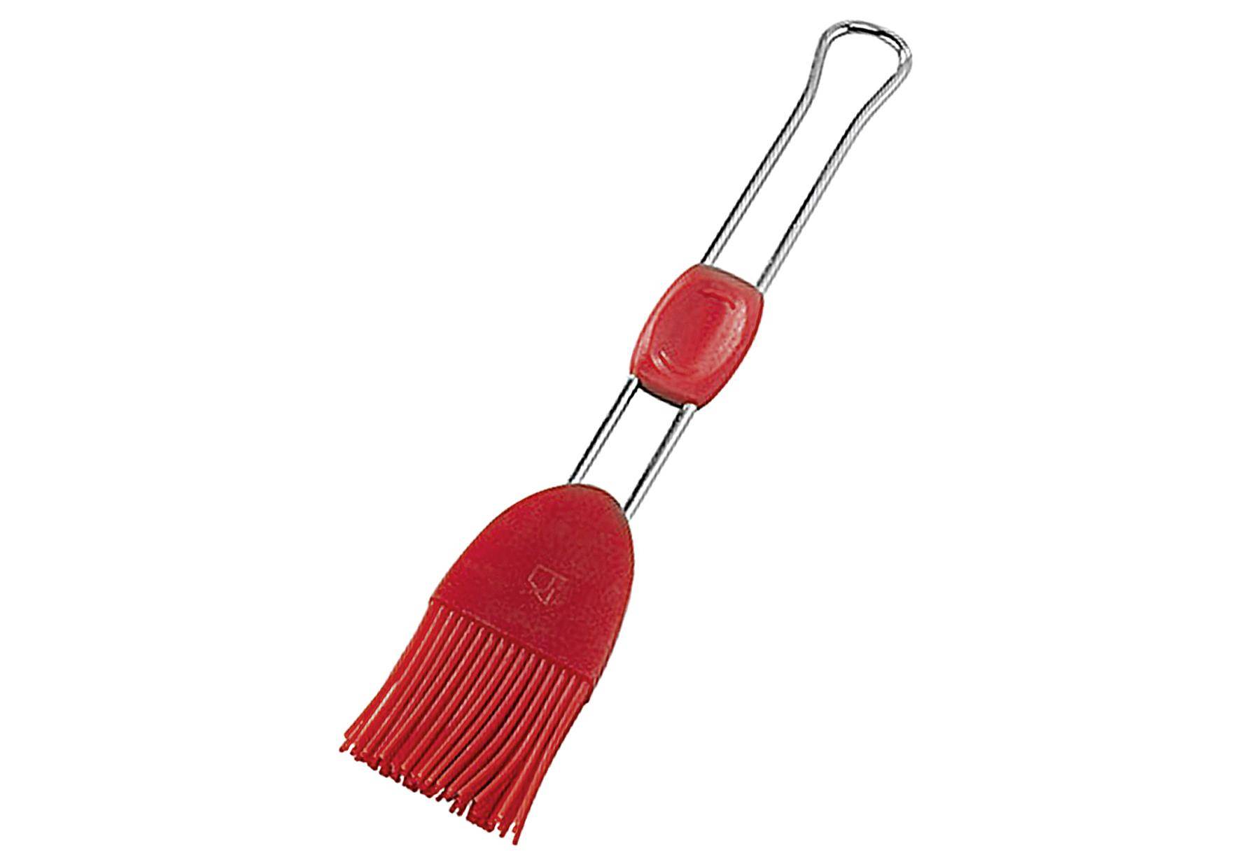Ein roter Silikongrillpinsel mit Metallgriff, verwendet zum Auftragen von Saucen oder Marinaden beim Kochen.