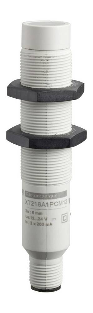Ein zylindrischer weißer Sensor mit gewindeter Gehäuse und schwarzer sechskantiger Befestigungsmutter. Das Gehäuse trägt den Text 'Telemecanique XT1'.
