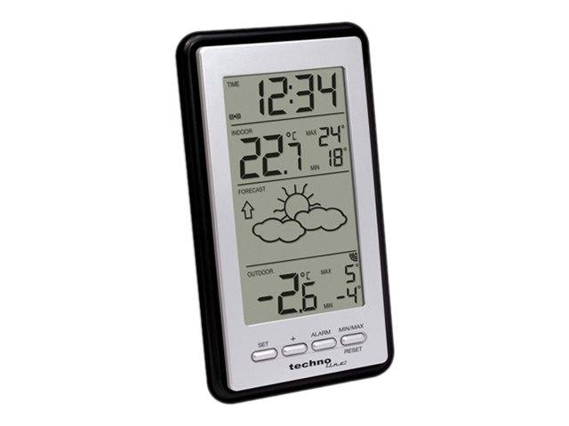 Digitale Wetterstation zeigt die Uhrzeit 12:34, Innentemperatur 22,7°C, Vorhersage teilweise bewölkt und Außentemperatur -2,6°C.