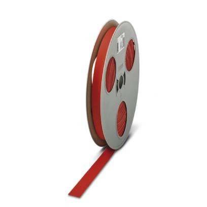 Eine große Rolle rotes Band steht aufrecht, mit mehreren Schleifen, die auf der grauen Spule vor einem weißen Hintergrund sichtbar sind.