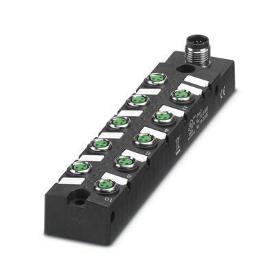 Ein schwarzes elektronisches Gerät mit mehreren grünen Anschlüssen, beschriftet mit Nummern. Es verfügt über einen einzelnen zylindrischen Anschluss an einem Ende.