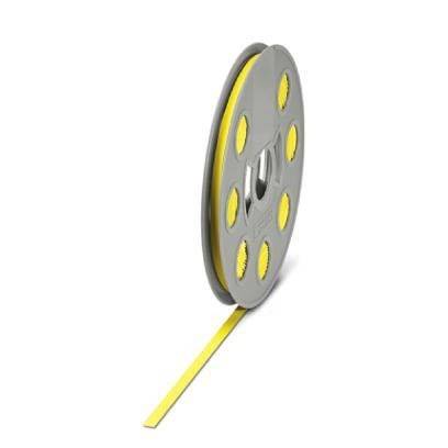 Eine graue Spule wickelt teilweise eine Rolle aus gelbem Material ab, die wie Band oder Film aussieht, wobei Löcher auf der Spule sichtbar sind.