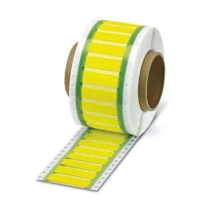 Eine Rolle gelber Etiketten mit grünen Rändern auf einem weißen perforeiten Trägermaterial, teilweise abgerollt, um mehrere Etiketten zu zeigen.