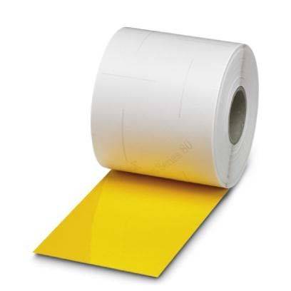 Eine Rolle weißer Etiketten mit Klebeschicht, teilweise abgerollt, sodass ein gelbes Etikett sichtbar ist. Die Rolle steht aufrecht auf einem neutralen Hintergrund.