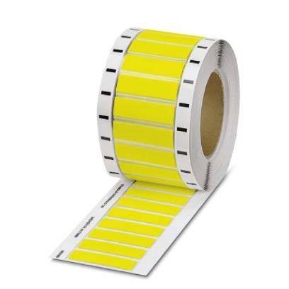 Eine Rolle gelber Klebeetiketten mit schwarzen Linien, die die Trennung zwischen den einzelnen Etiketten anzeigen. Die Rolle ist teilweise abgerollt.