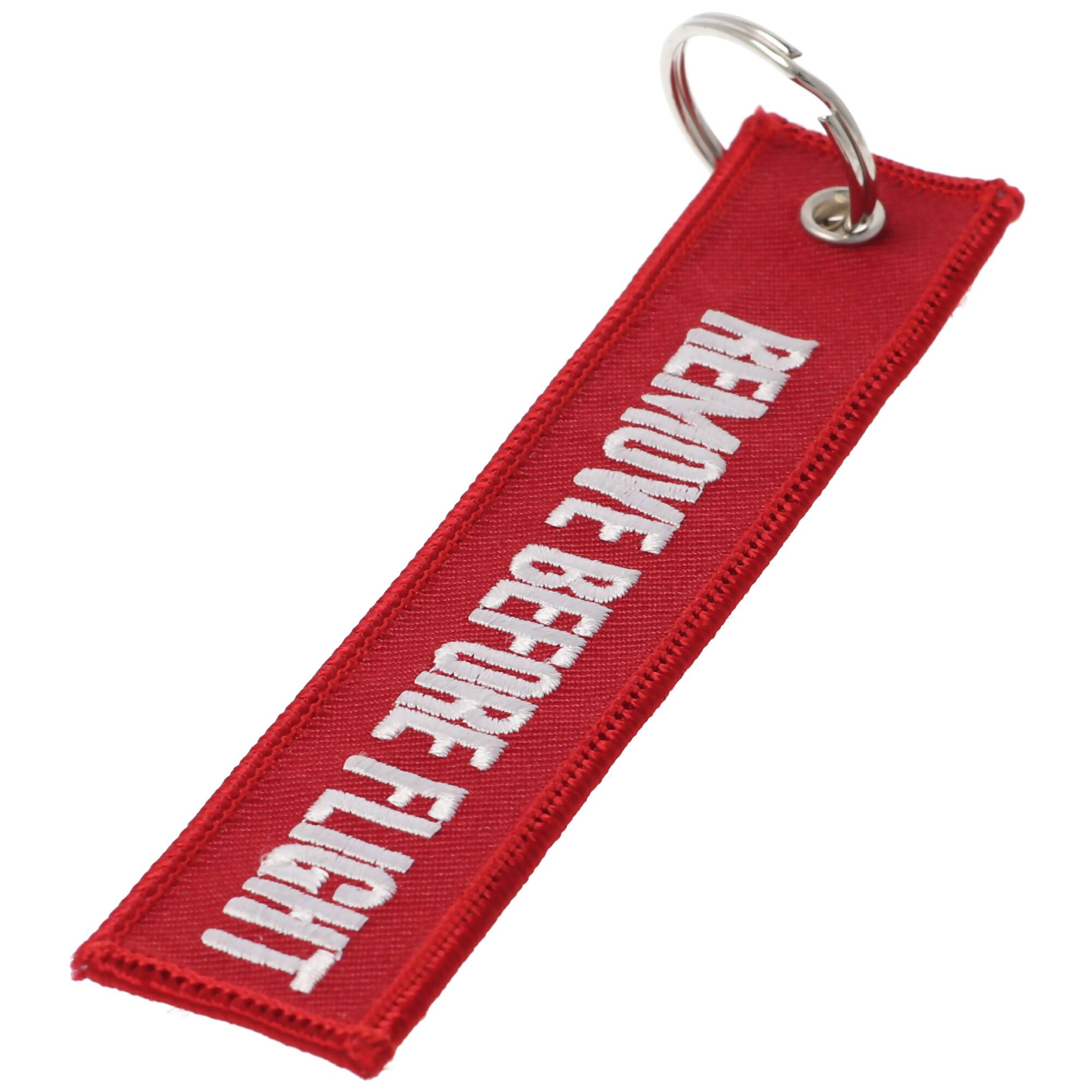Anhänger mit Schriftzug Remove before flight ca. 13 x 2,8 cm