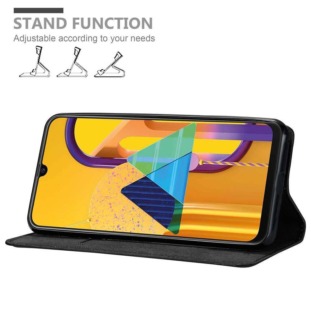 Cadorabo Hülle für Samsung Galaxy M21 / M30s Schutz Hülle in Schwarz Handyhülle Etui Case Cover Magnetverschluss